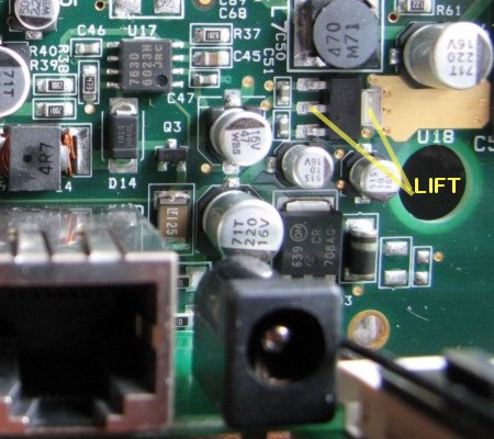 Power supply section of SB3 showing where to lift the output tabs of U8.