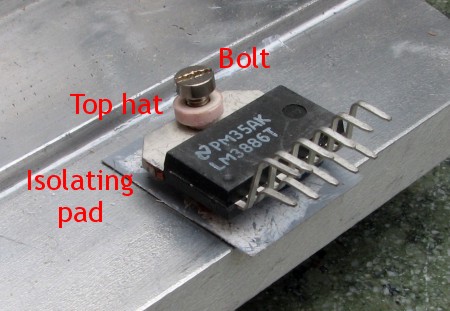 Chip mounted on heatsink with isolating pad.