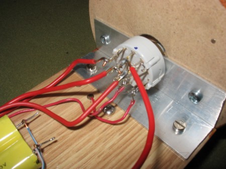 The rotary switch wired to switch power and speakers.